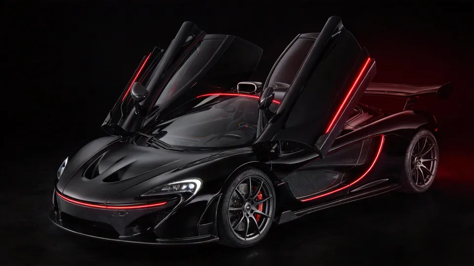 Mid-engined hypercar in an ink-black studio, dihedral doors raised, deep red light tracing its roofline and rear wing